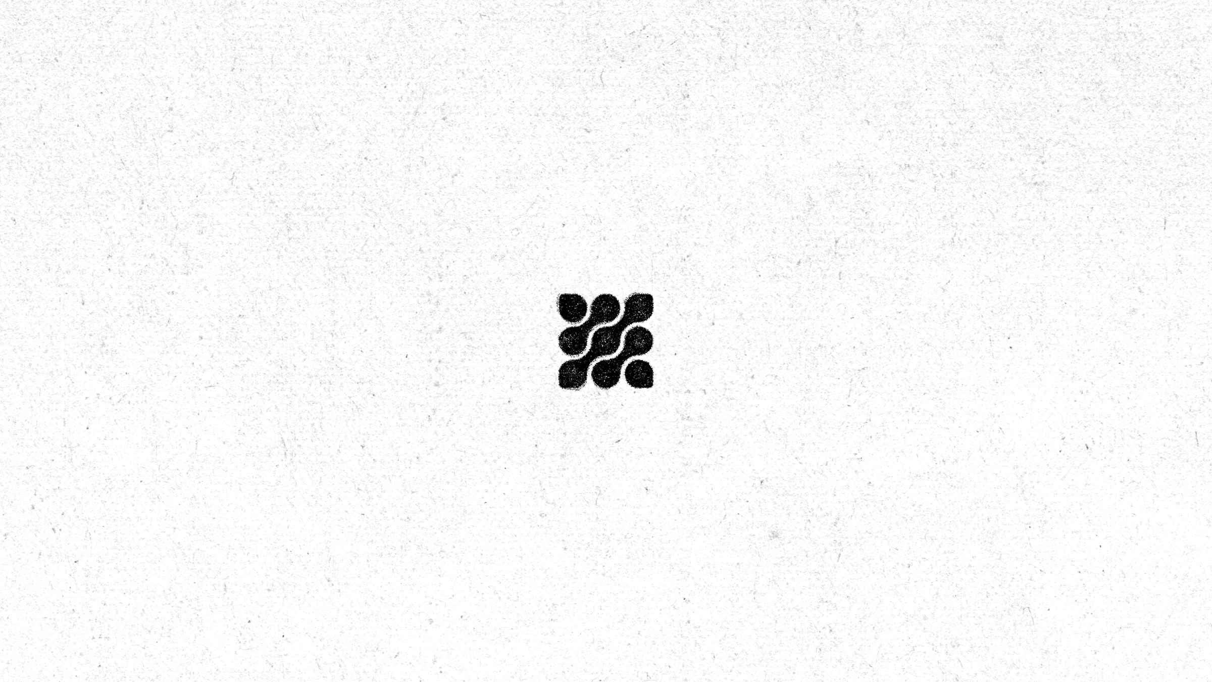 Gamlify mark in black on textured white paper
