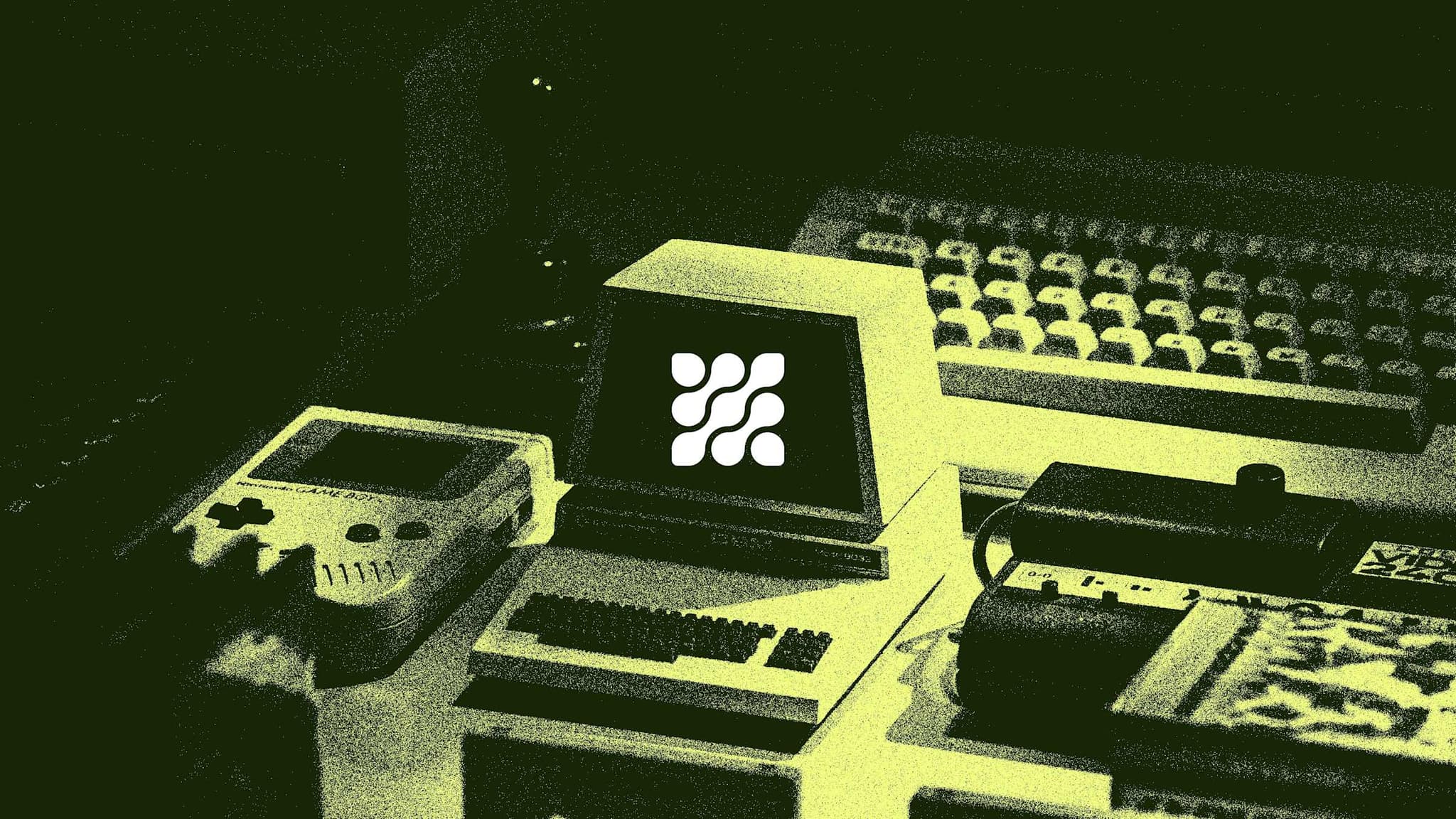 Gamlify mark on the screen of a retro computer surrounded by handheld consoles