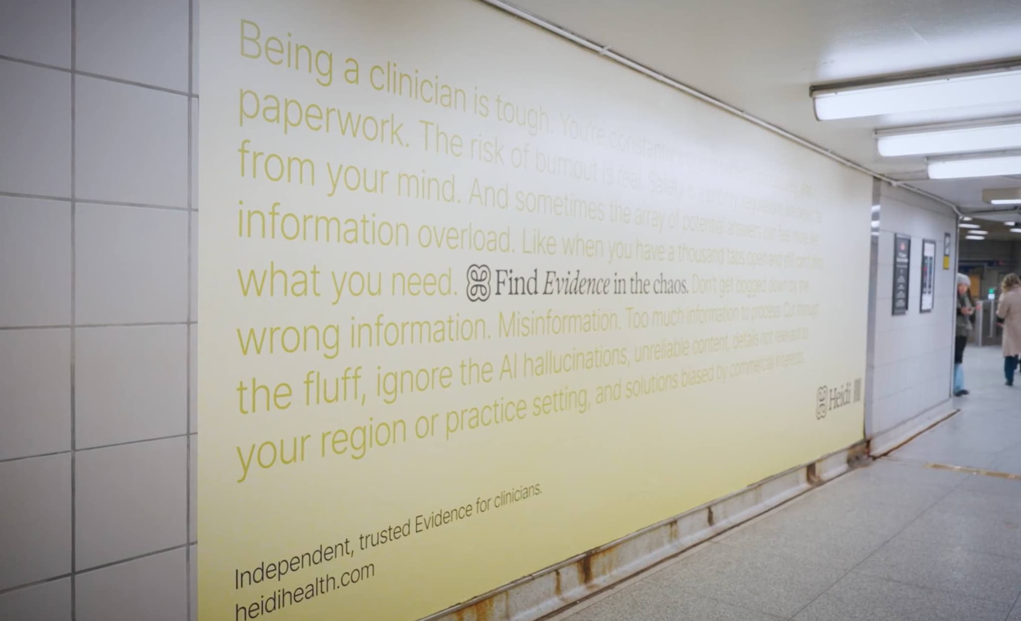 Heidi wall ad lining an underground pedestrian corridor